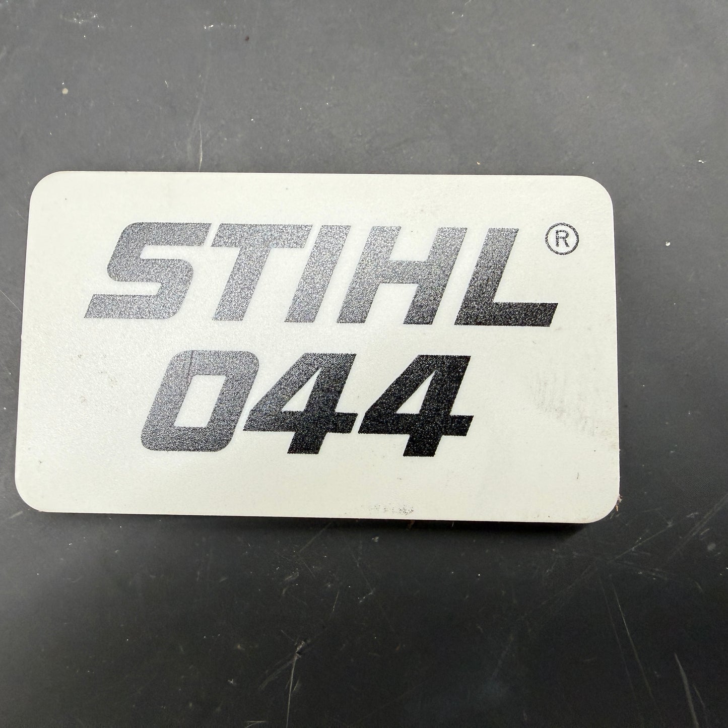 044 Stihl OEM Top Cover Badge
