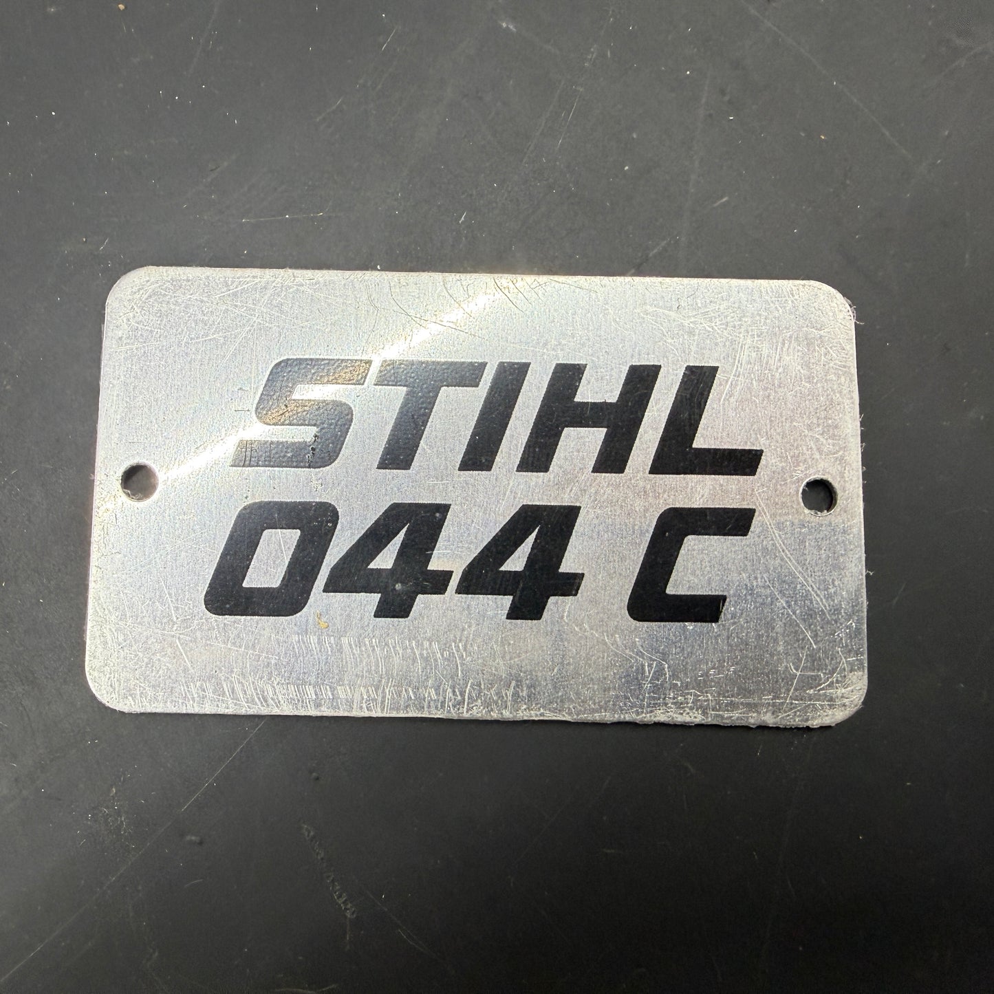 044 C Stihl OEM Metal Top Cover Badge NOS NLA