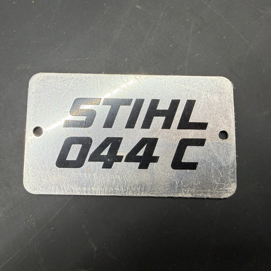 044 C Stihl OEM Metal Top Cover Badge NOS NLA