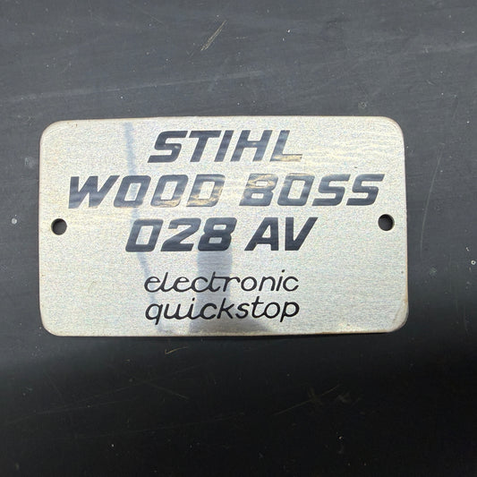 028 Wood Boss AV OEM Stihl Metal Top Cover Model Badge